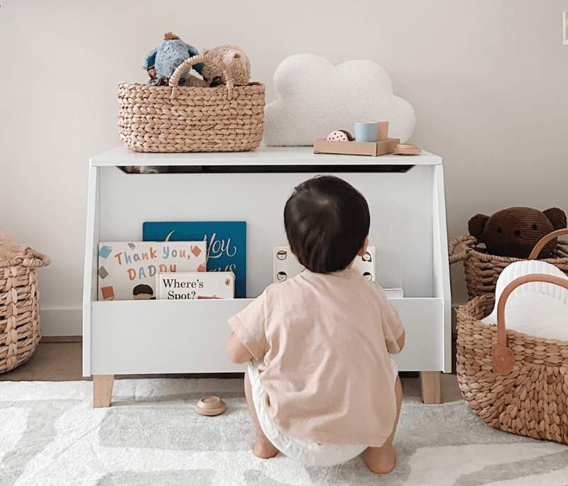 Kid in front of bookcase